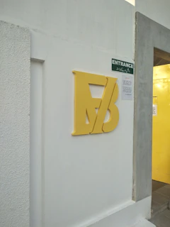 The bright and welcoming entrance of Taalgym, with the logo visible and inviting.