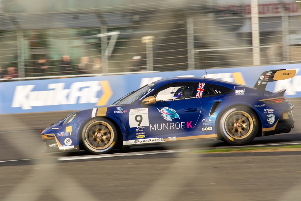 a blue race car on a track