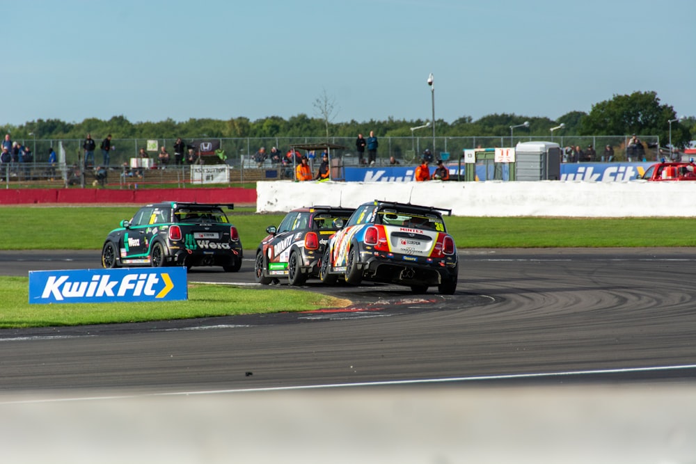 a group of race cars on a track