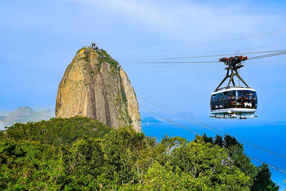a cable car above a rock