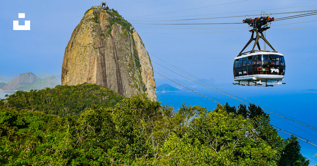 Cable Cars Between Rocks A cable car above a rock photo – Free Rio de janeiro Image on Unsplash