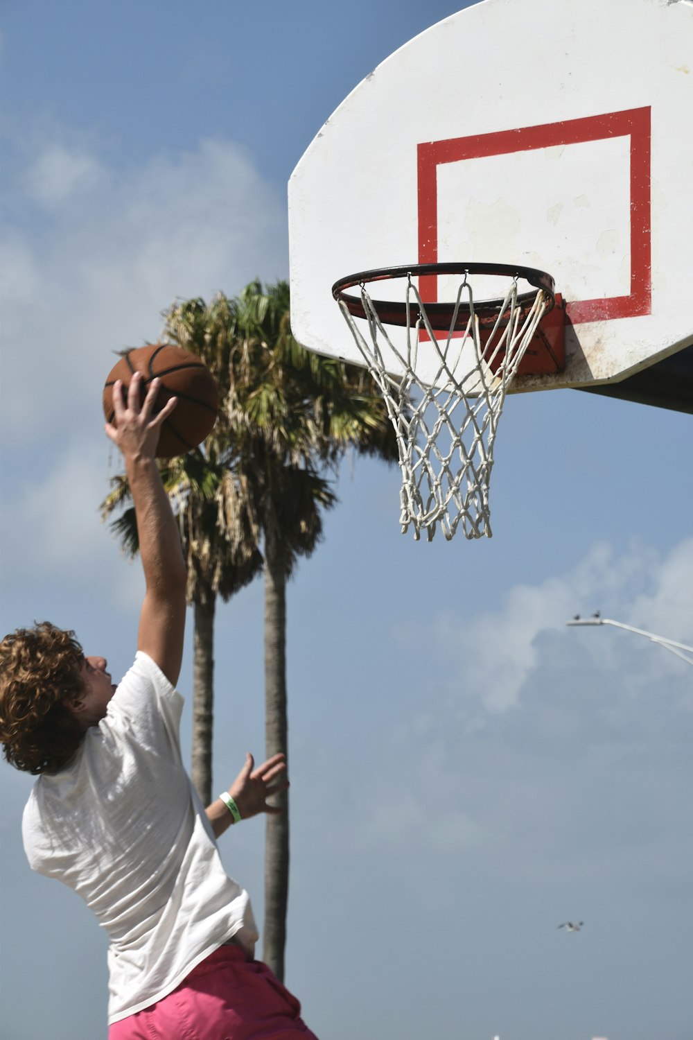 a man dunking a basketball