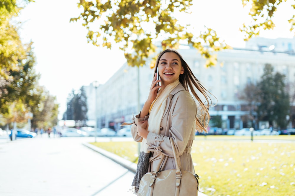 a woman standing on a sidewalk