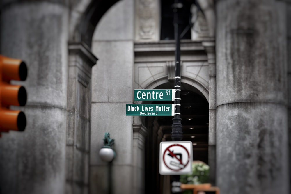 a street sign next to a traffic light