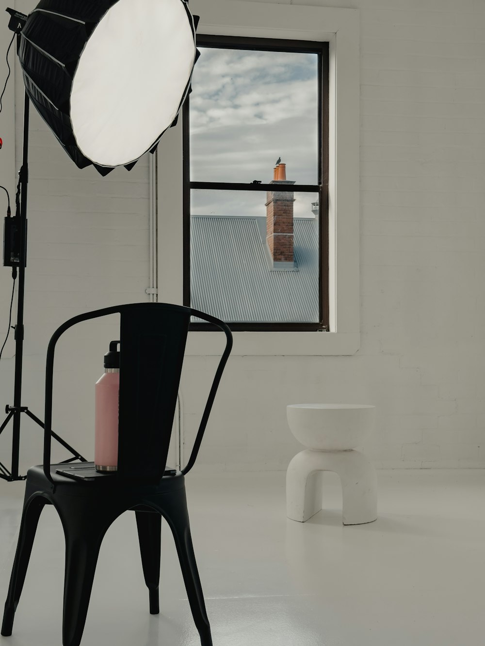 a chair and a toilet in a bathroom