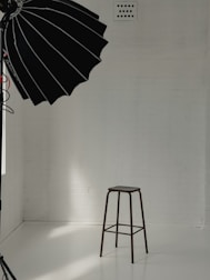 Minimalist black and gray studio space with Juan Baraza rehearsing a scene.
