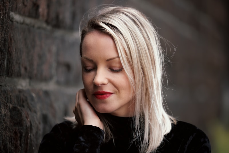 Stylish woman with hand on face