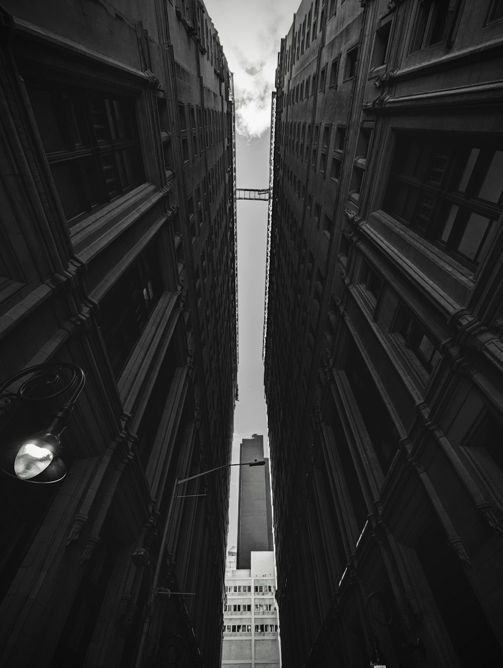 a view looking up at tall buildings