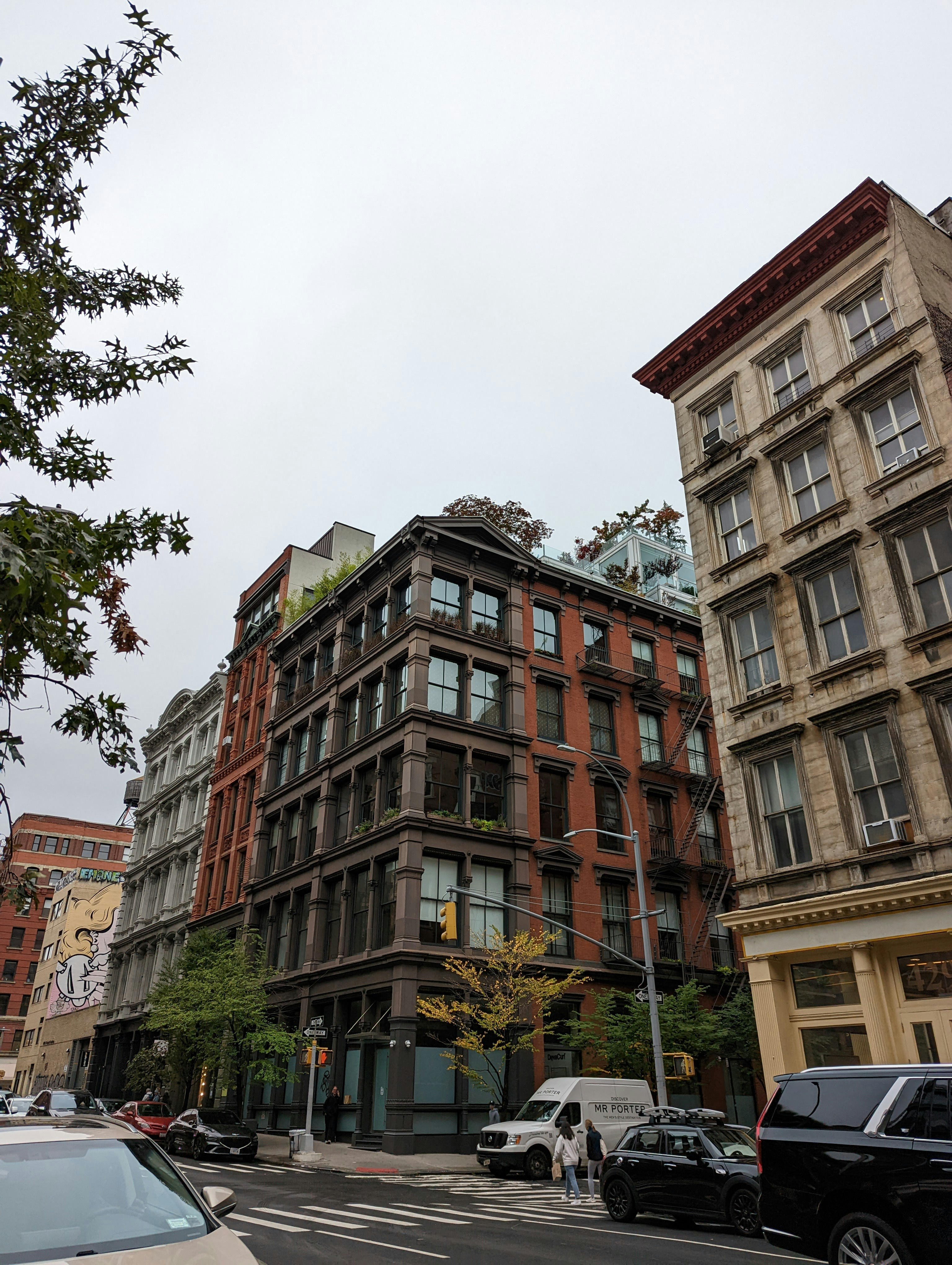 a street with cars and buildings on the side
