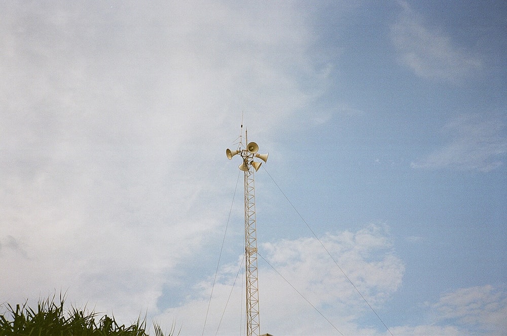 a tall tower with a cross on top