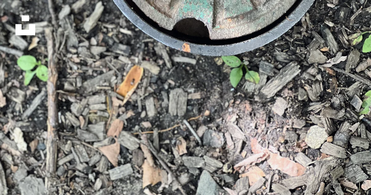 A round metal object on the ground photo – Free Central park Image on ...