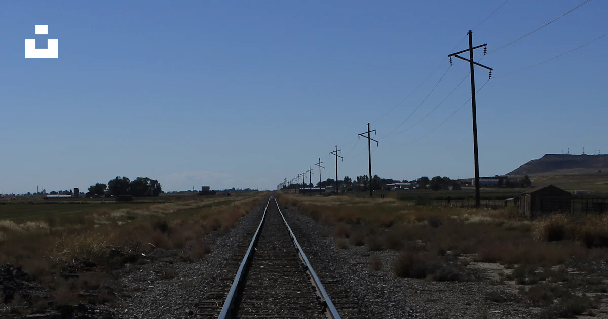 Train tracks in a field photo – Free Rail Image on Unsplash