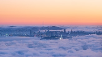 A mystical Seattle skyline shrouded in mist with dark red and purple hues.