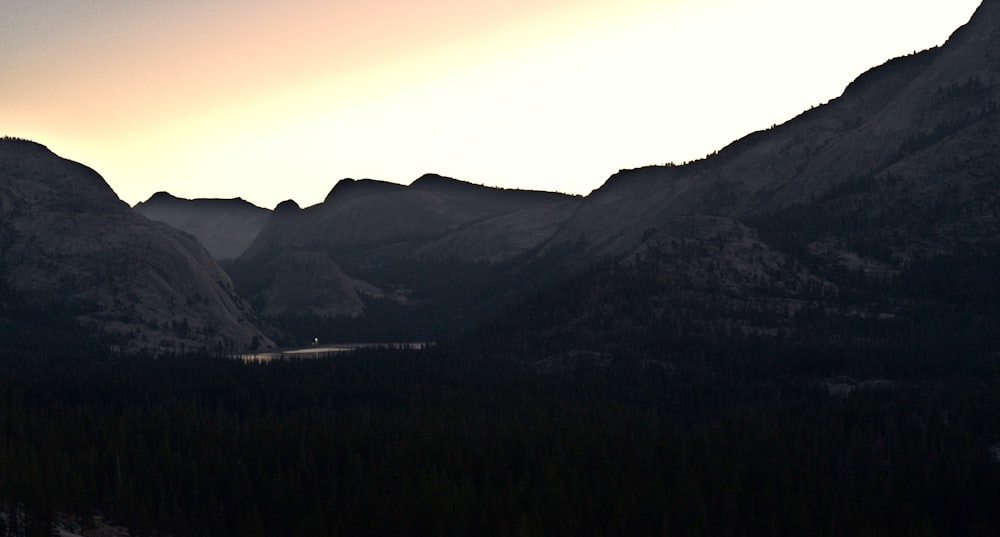 a landscape with hills and a road