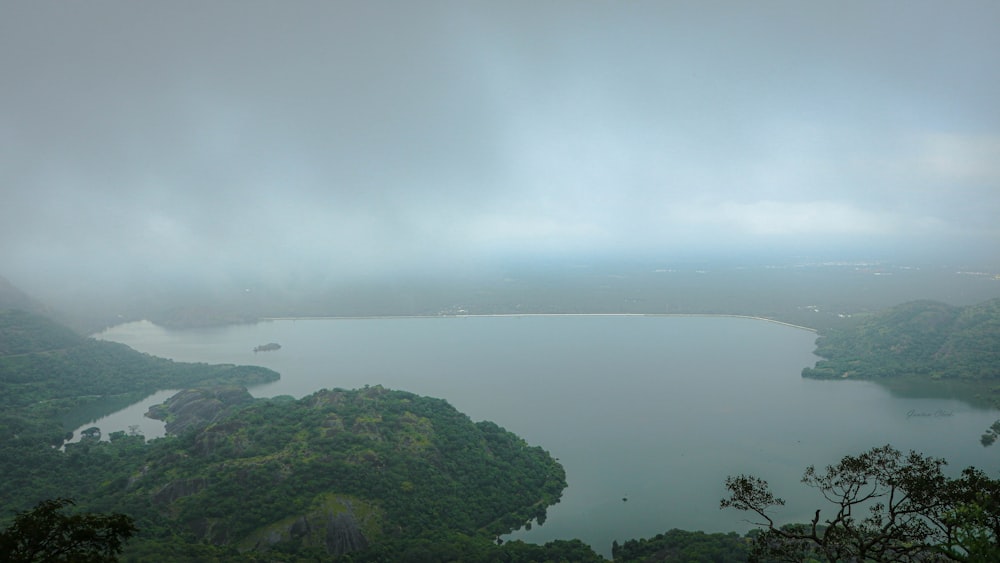 a body of water surrounded by hills