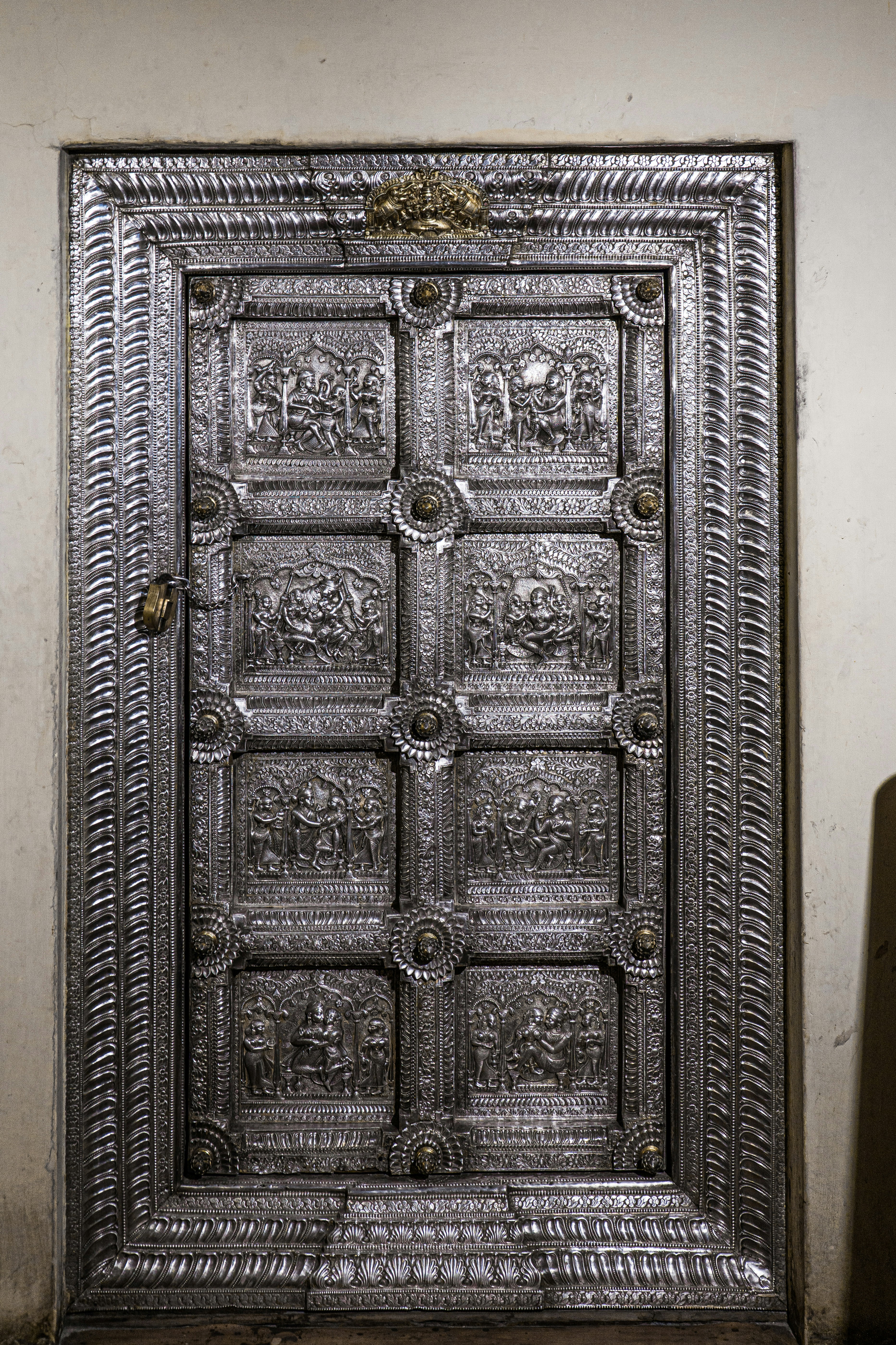 a wood cabinet with carvings