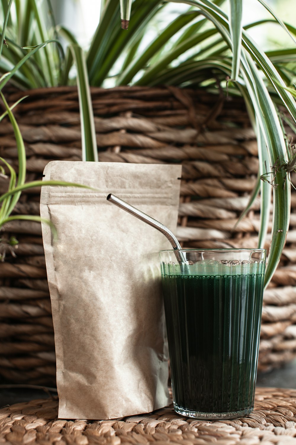 a couple of glass vases with plants in them