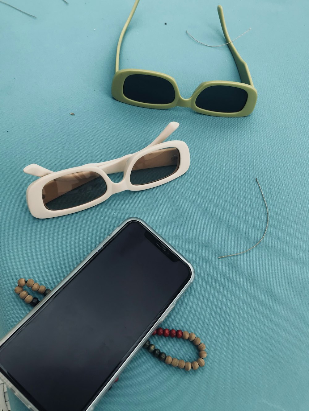 a cell phone and sunglasses