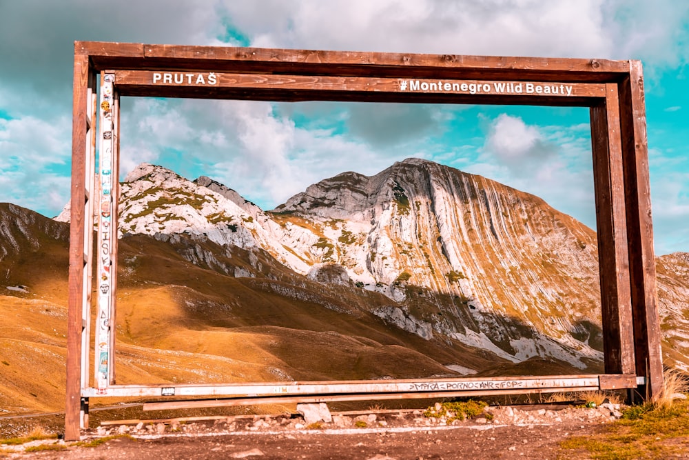 a sign on a mountain