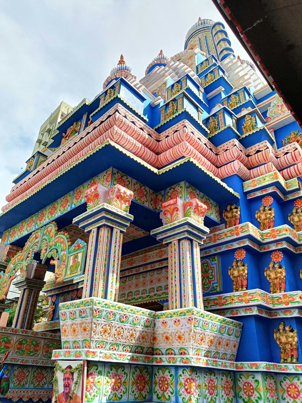 a colorful building with a blue roof