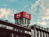 a large red sign on top of a building