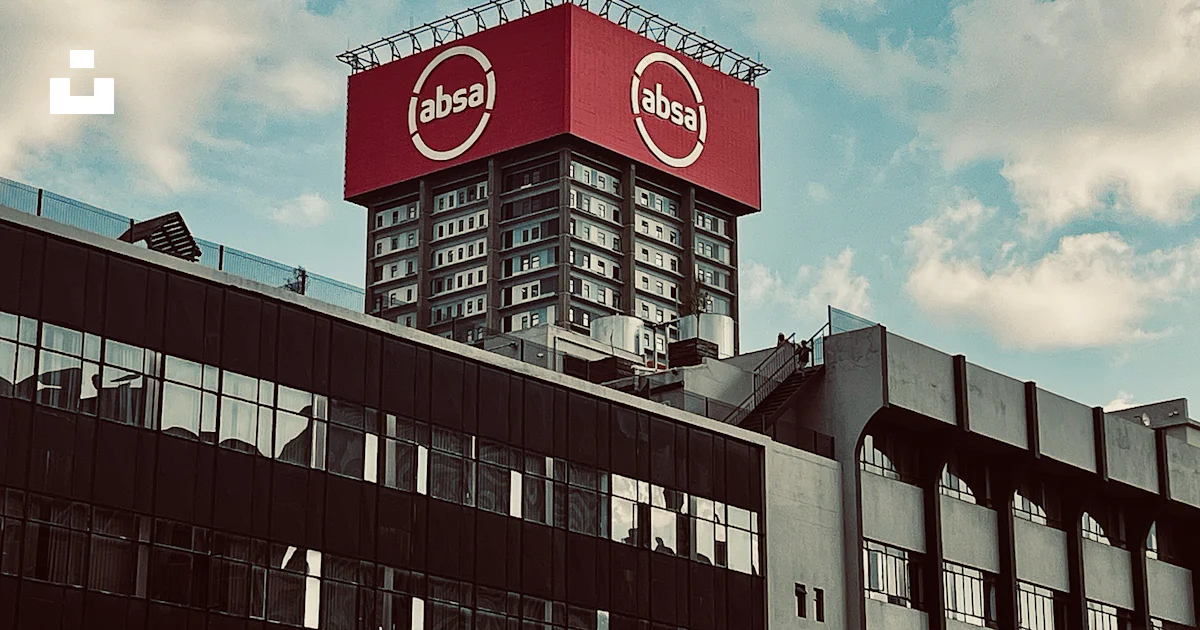 A large red sign on top of a building photo – Free Absa Image on Unsplash