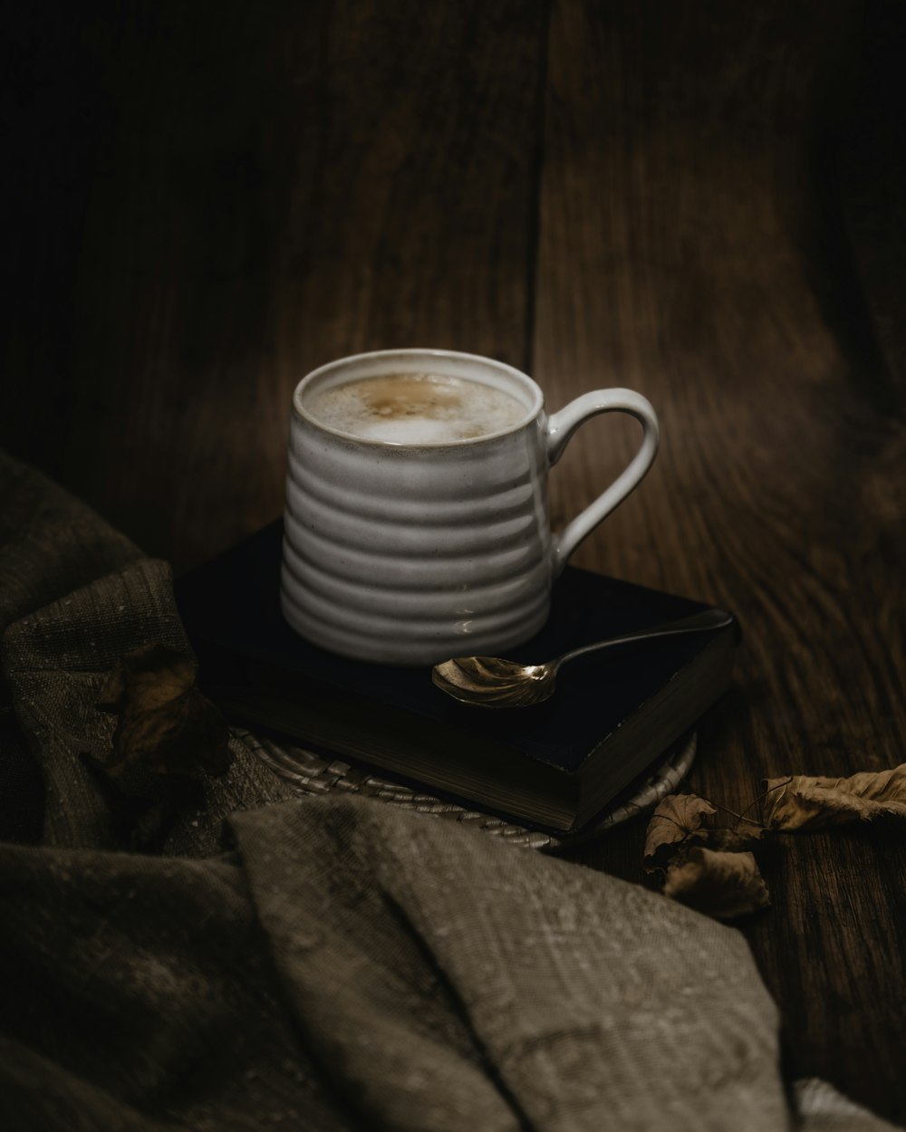 a cup of coffee on a coaster