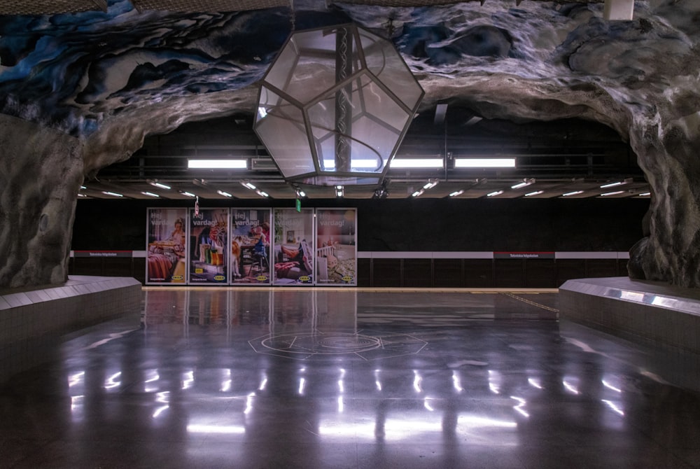 a large room with a large ceiling and a large statue