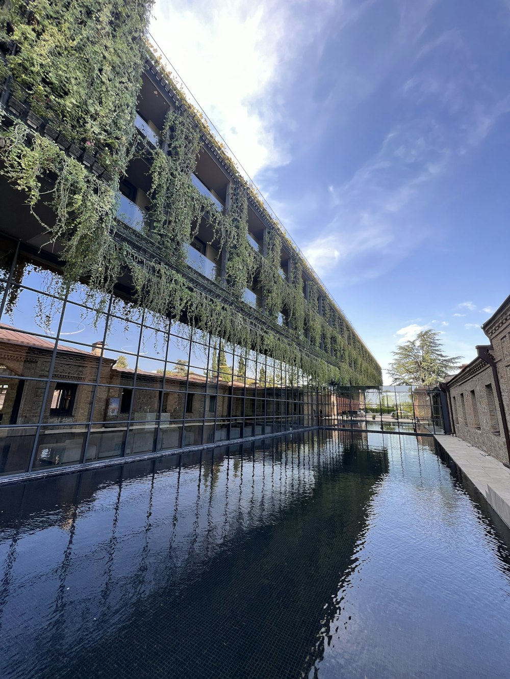 a building with a bridge over water