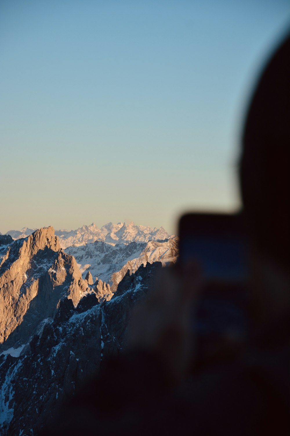 a view of a mountain range from a window