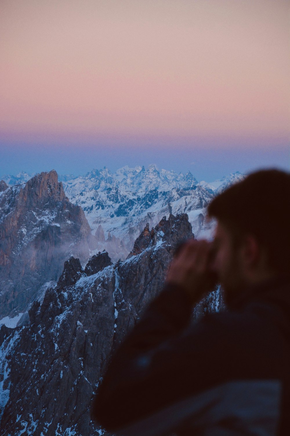 a man sitting on a mountain