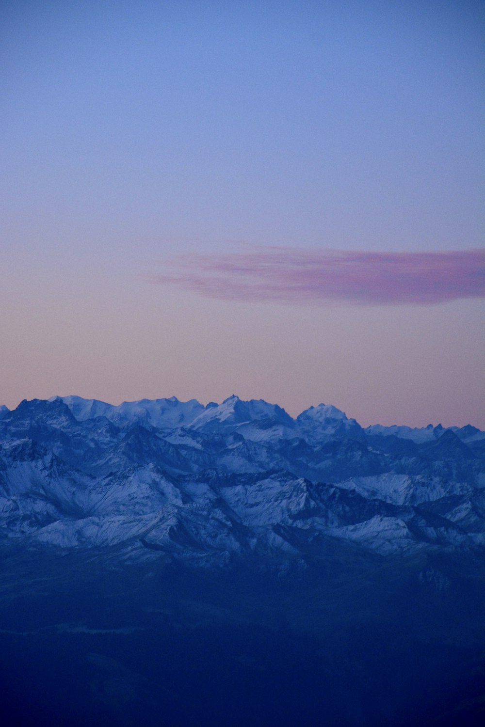 a mountain range with a purple sky