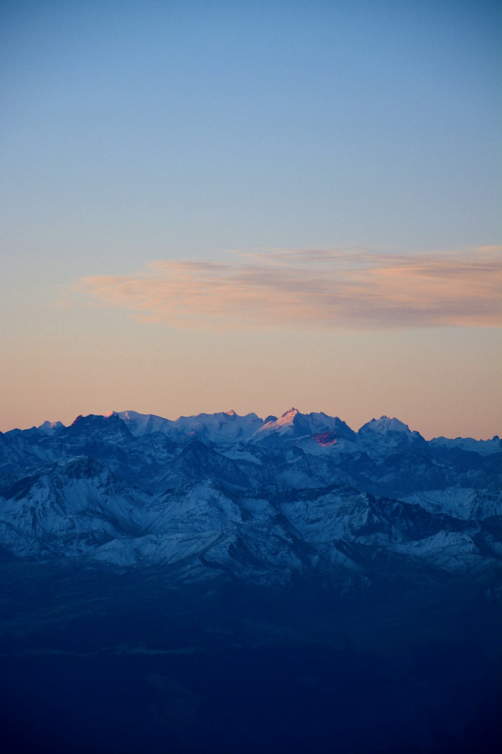 a mountain range with a blue sky