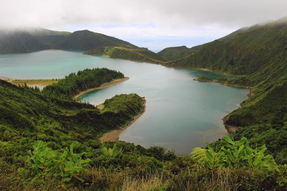 a body of water surrounded by hills