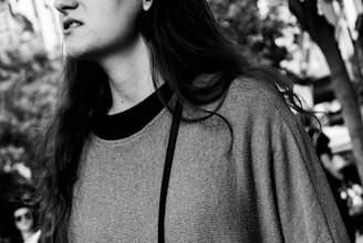 A dynamic shot of a model walking outdoors in layered apparel, capturing movement and comfort.