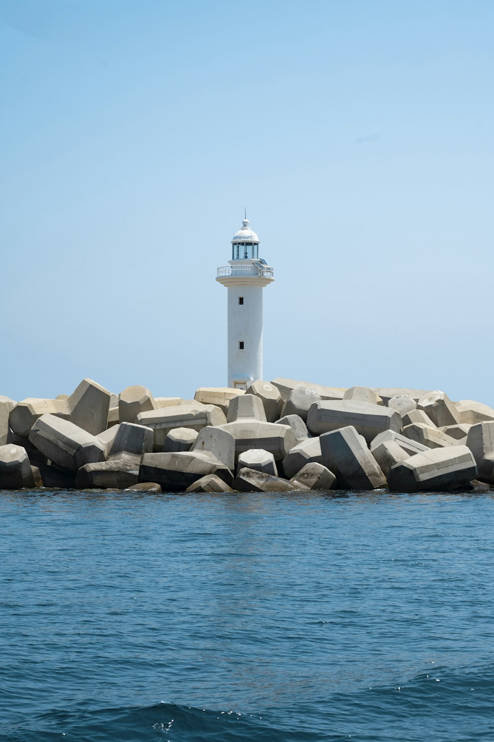 a lighthouse on a rocky island