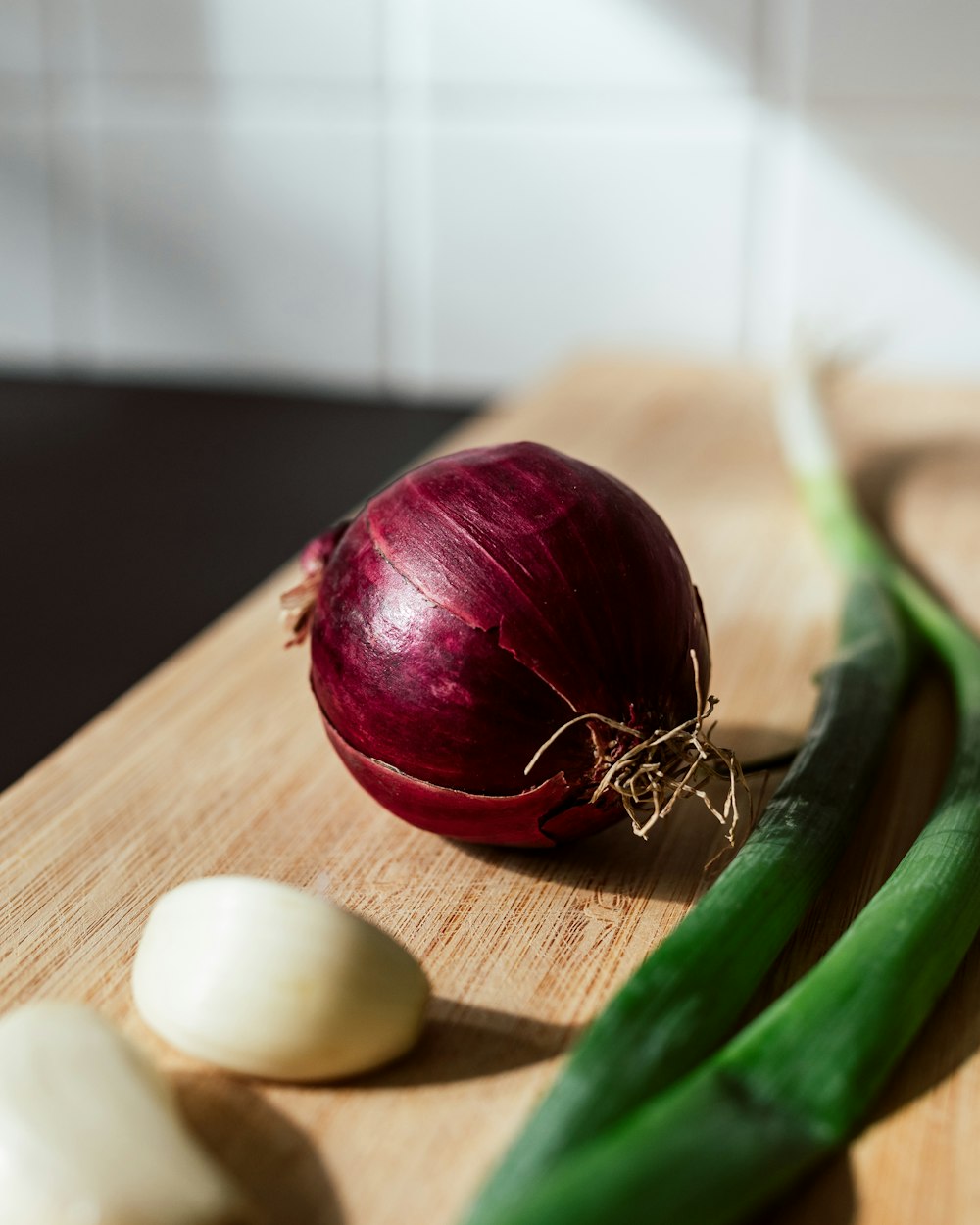 a red vegetable on a wooden surface