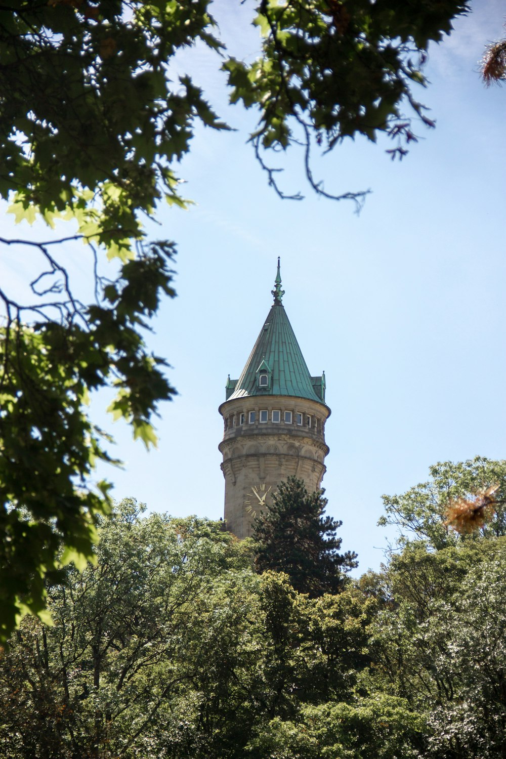 a tall building with a green roof