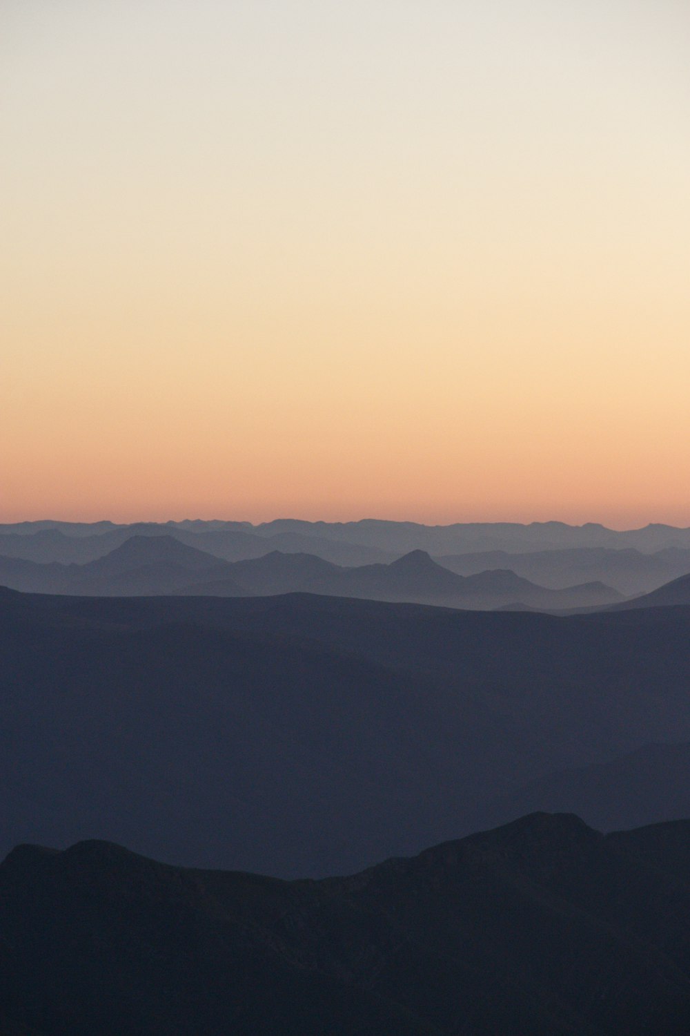 a view of the mountains at sunset