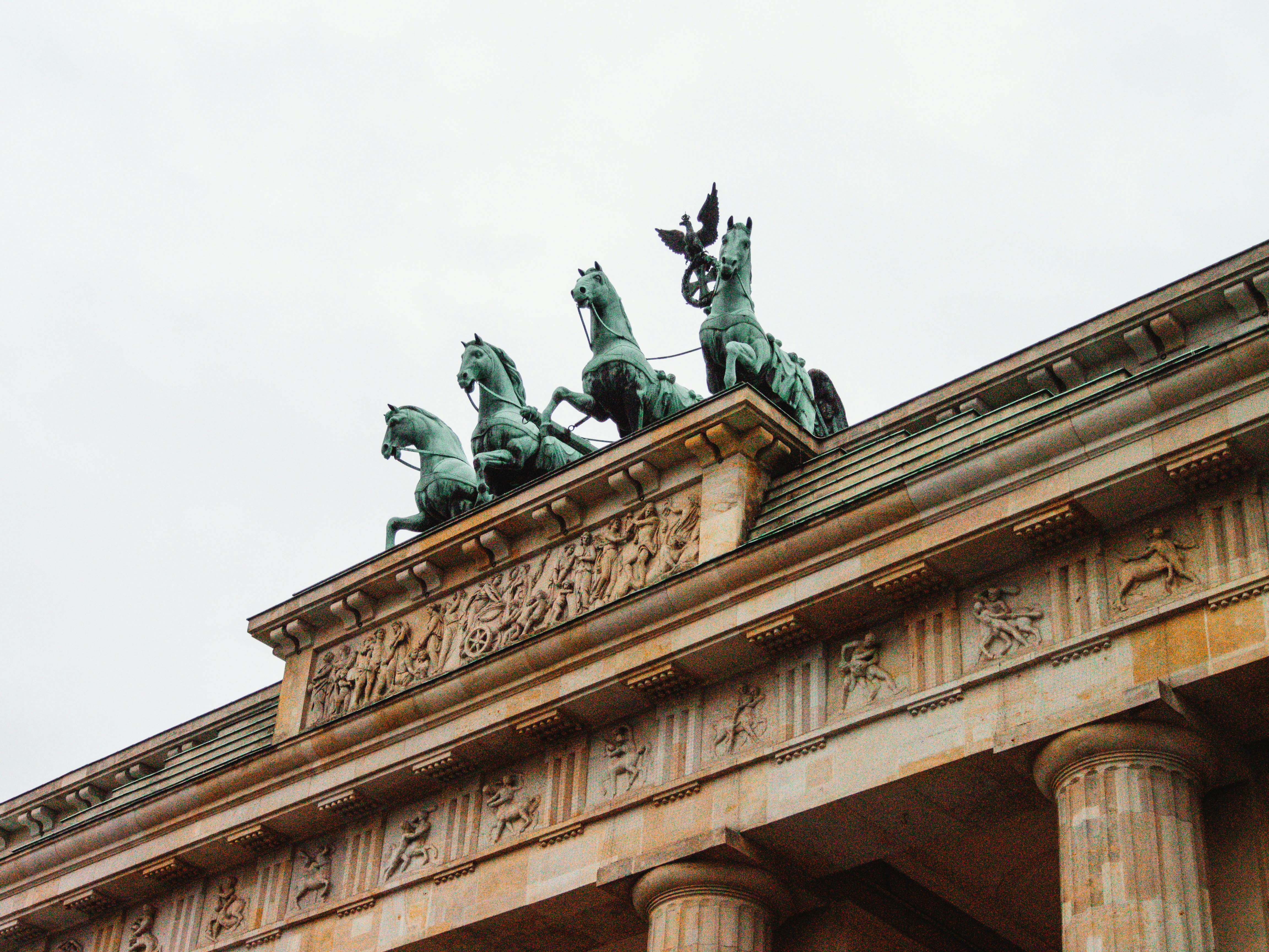 a building with statues on top