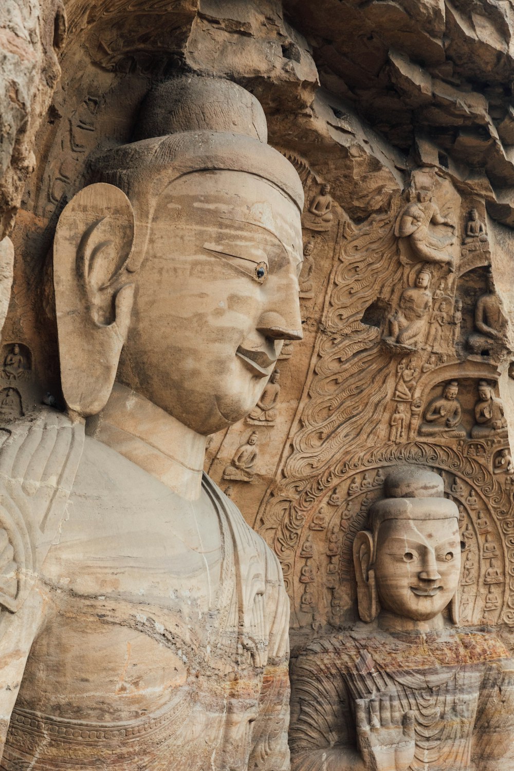 a stone sculpture of a man and a woman