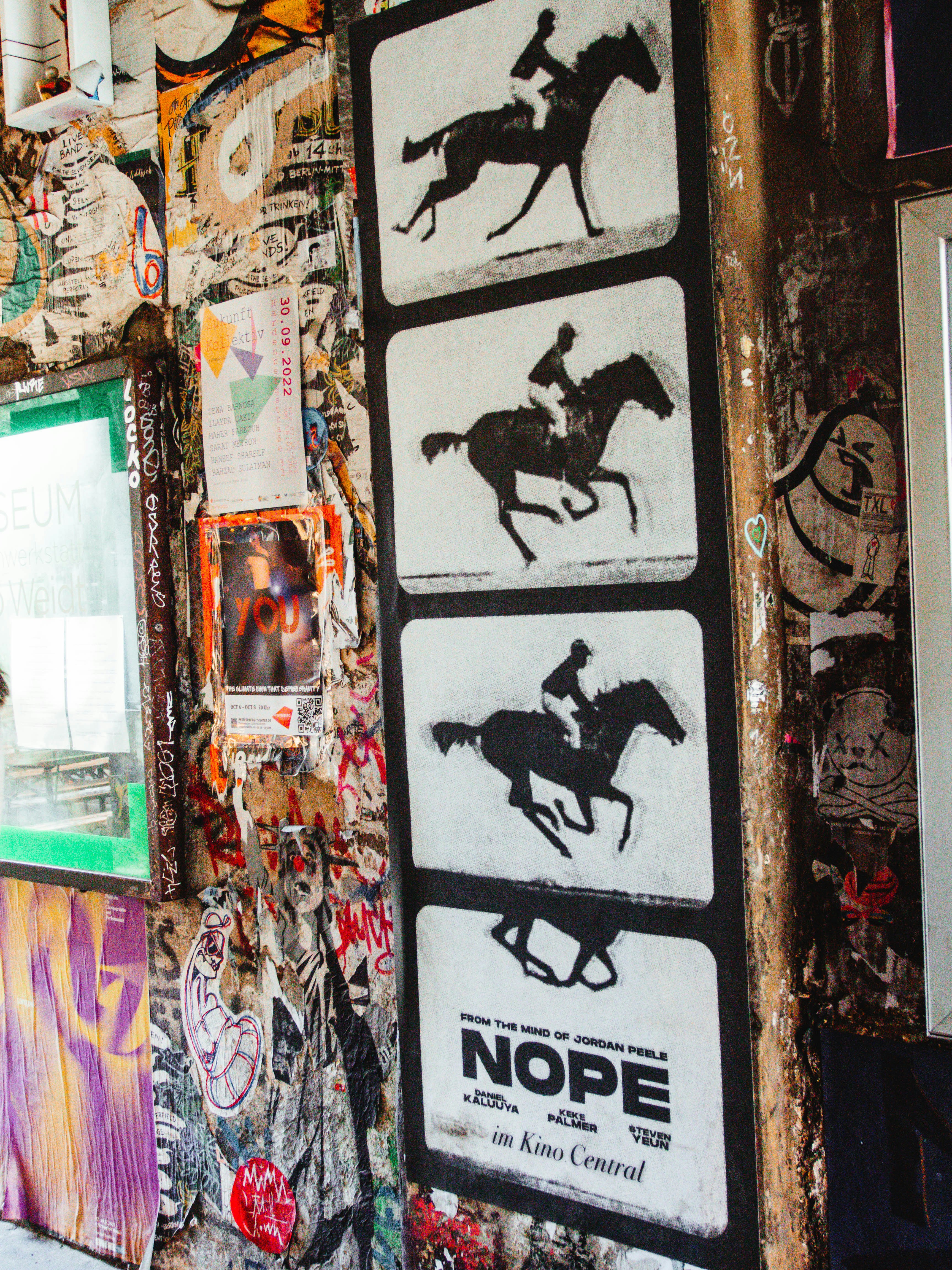 a wall covered in posters