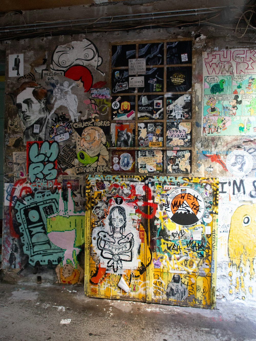 a wall covered in graffiti