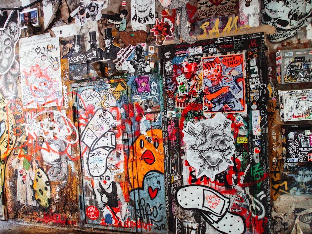 a wall covered in graffiti