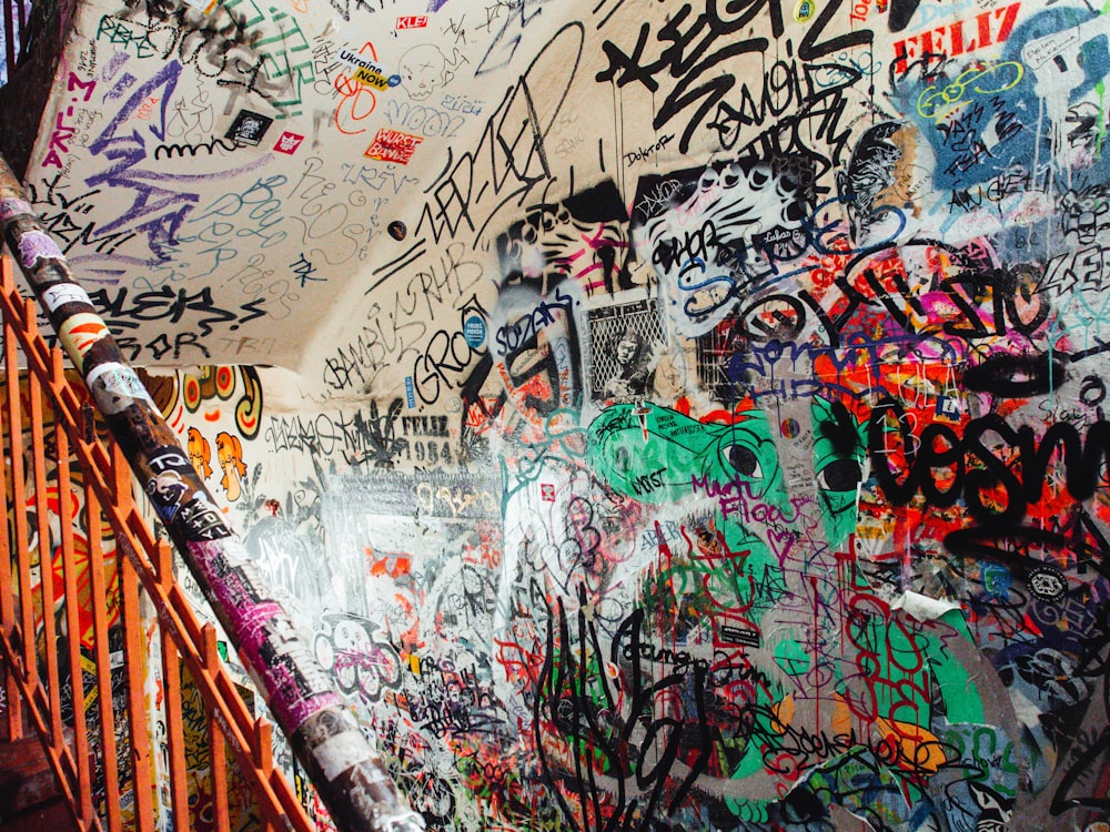 a wall covered in graffiti