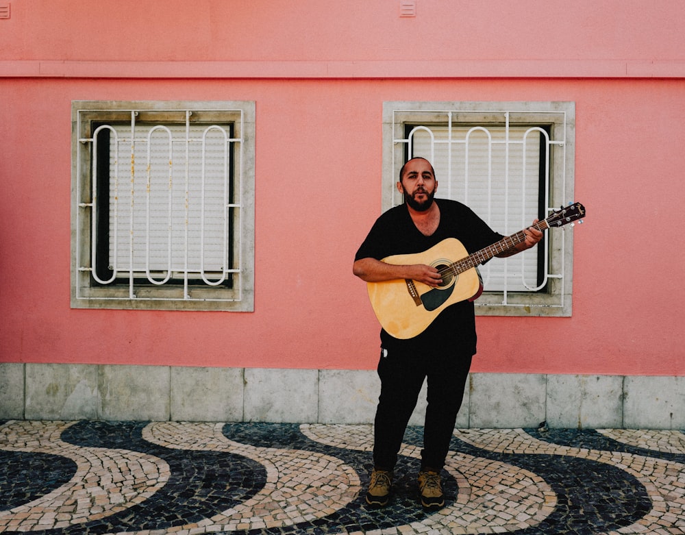 a person holding a guitar