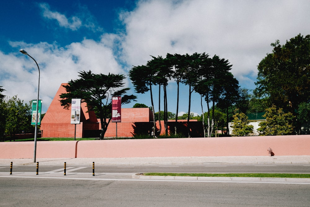 a street with trees and a building