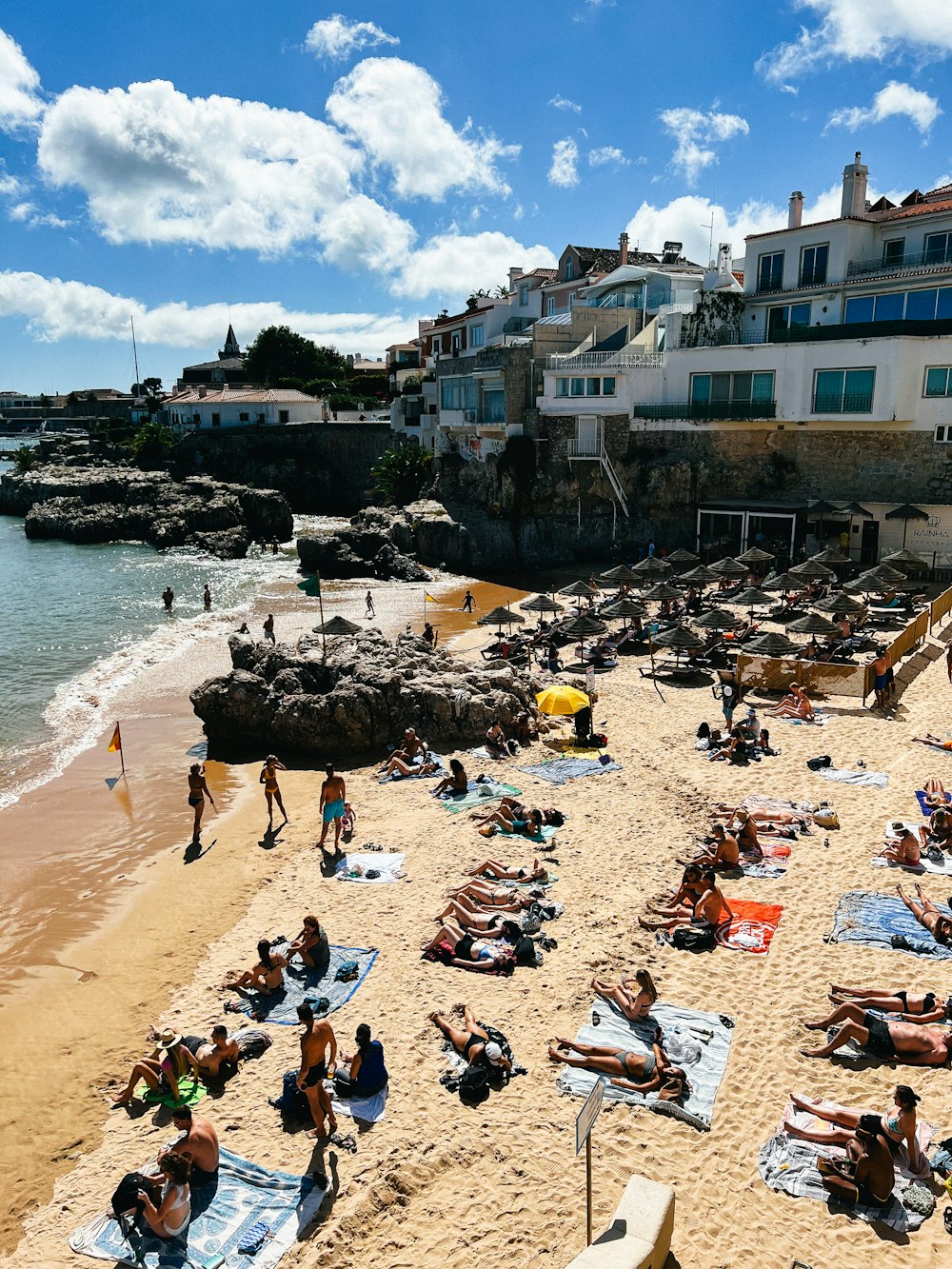 a crowded beach with people