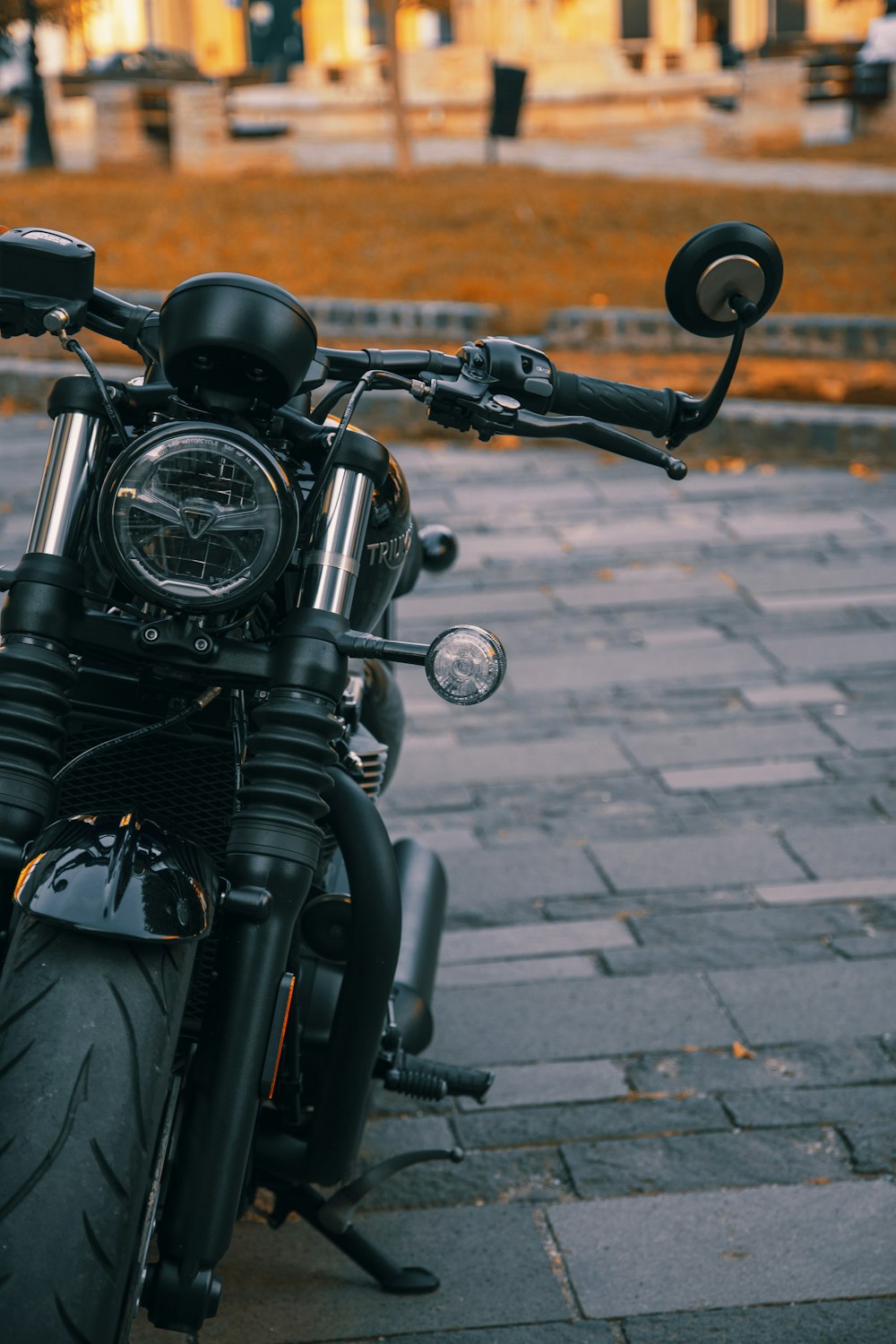 a motorcycle parked on a sidewalk