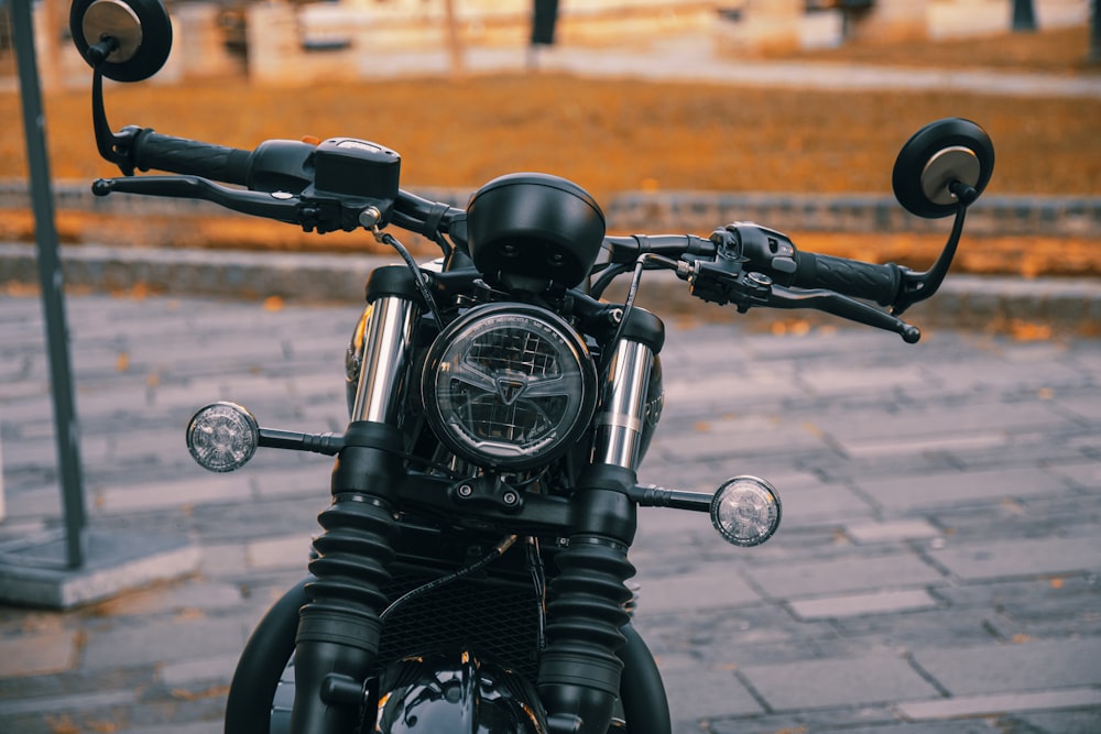 a motorcycle parked on a sidewalk